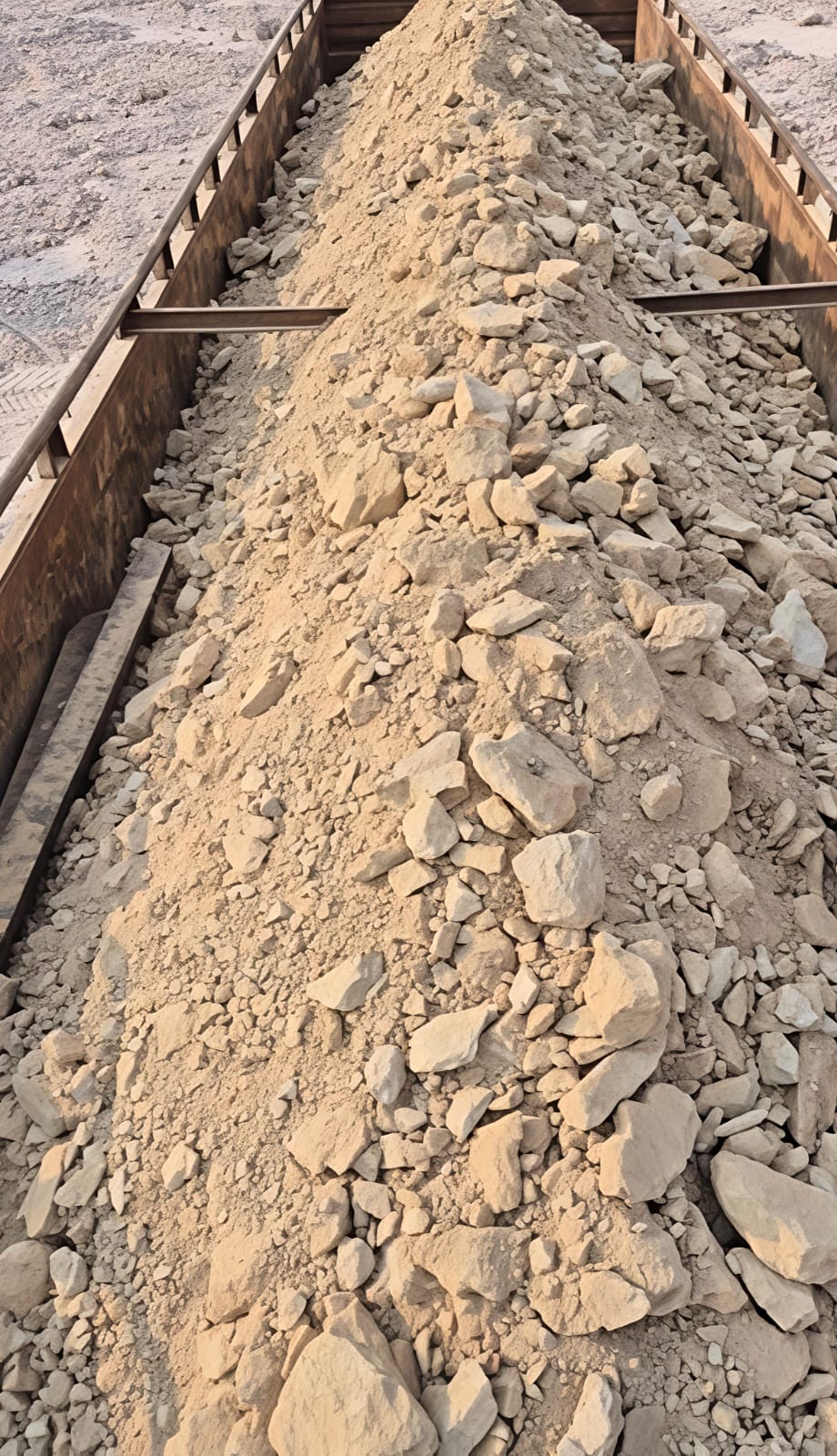 Loose mineral material being loaded into containers at port for export